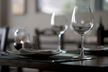 table setting in the restaurant, glasses and cutlery, a clean new table in the restaurant is waiting for guests, a free table