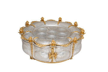 Elegant ornate silver seder plate with intricate engravings and decorative details, isolated on white background, used for ceremonial and religious purposes.