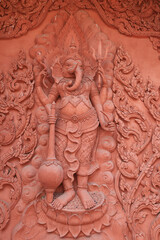 KOH SAMUI, THAILAND - APRIL 5: View of the red Buddhist temple and the palace with sculptures April 5, 2023, Koh Samui, Thailand