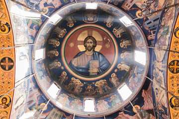 Ornate Church Dome with Religious Frescoes and Central Jesus Image
