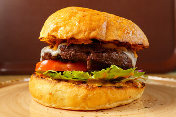 Juicy beef burger with fresh toppings served on a toasted bun at a casual diner in the afternoon