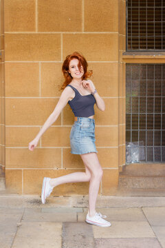 student being silly on uni campus