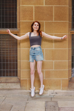 student being silly on uni campus