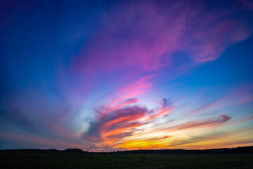 Beautiful sky background with clouds after sunset. Red yellow sky.