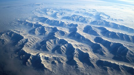 Aerial View of a Majestic Snow-Capped Mountain Range