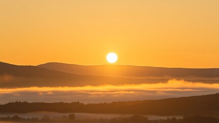 Fototapeta premium Sunrise over misty mountains