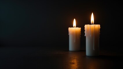 Candlelit Darkness: Two Candles Illuminate Brightly in the Night