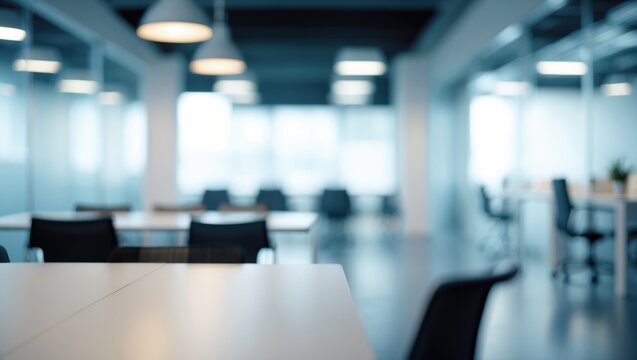 Blurred background of a sleek modern coworking office with minimalist design and functional furniture for professionals
