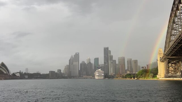 City Stdney harbour bridge rain with rianbow