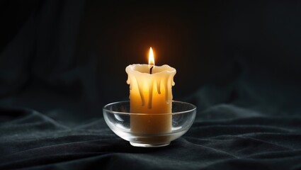 Memorial Ceremony Concept with Single Burning Candle on Black Background for Mourning and Condolences