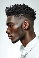 Fototapeta premium Stylish Black Man's Profile: High-Top Fade Haircut, Modern Minimalist Portrait