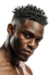 Fototapeta premium Intense Male Portrait: Dark Skin, Curly Hair, and Brooding Gaze
