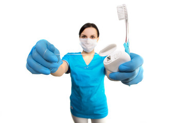 Dentist with tools. Concept of dentistry, whitening, oral hygiene, teeth cleaning with toothbrush, floss. Dentistry, taking care of a beautiful and healthy smile. Dental tooth care clinic. Stomatology