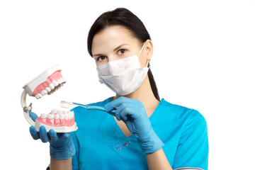 Dentist with tools. The concept of dentistry, whitening, oral hygiene, teeth cleaning with toothbrush and floss. Dentistry, taking care of a beautiful and healthy smile. . Stomatology