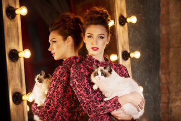 Young beautiful girl in the mirror in a nightclub. Beauty woman. Fashionable stylish model. Luxury Lady.