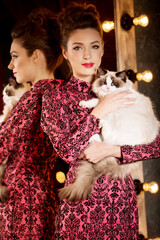 Young beautiful girl in the mirror in a nightclub. Beauty woman. Fashionable stylish model. Luxury Lady.