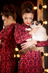 Young beautiful girl in the mirror in a nightclub. Beauty woman. Fashionable stylish model. Luxury Lady.