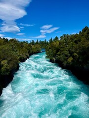 Amazing view of Huka Falls in New Zealand, renowned for its vibrant turquoise waters and powerful,...