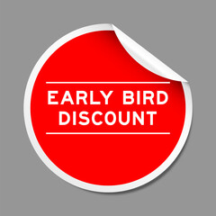 Red color peel sticker label with word early bird discount on gray background