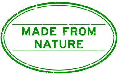 Grunge green made from nature word oval rubber seal stamp on white background