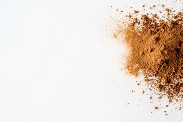 A vibrant cloud of golden powder is captured mid-air, showcasing its beauty and motion against a crisp white surface, ideal for creative projects