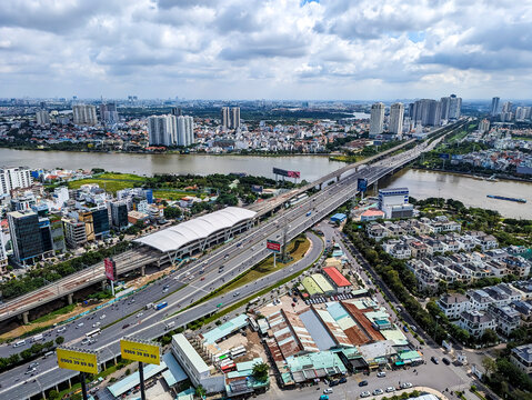 Ho Chi Minh, Vietnam - Sept 30, 2023: Overhead view of Tan Cang Station on Metro Line 1 beside the Hanoi Highway and Saigon River, connecting B&igrave;nh Thạnh with Thu Duc City.