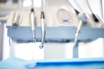 Portraits of doctor and patient in dentist's office. Shallow DOF. Developed from RAW; retouched...