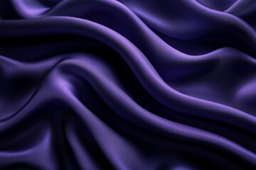 Fototapeta premium Soft purple fabric draped elegantly in flowing waves shows rich texture and depth during low light conditions