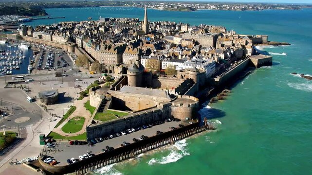 Aerial 4k hd video of Saint -Malo , historic French port in Ille-et-Vilaine, Brittany. France travel and landmarks. view of city center and castle. 