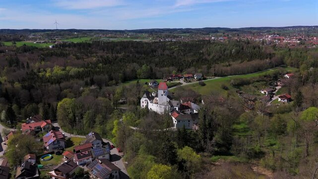 Aerial view of Schloss Elkofen, also known as Burg Elkofen, Schloss Elkhofen, near Grafing bei Muenchen, Germany. A medieval fortress surrounded by green fields in the Bavarian countryside. 