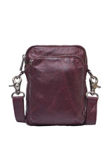 Maroon leather crossbody bag with zippered pockets and metallic details fashionable style . Cut out isolated on white background