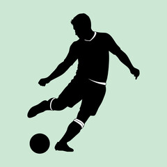 vector illustration of a silhouette of a football player kicking a ball during a match