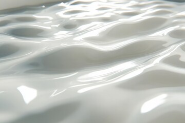 Obraz premium Fluid texture reflects light in serene environment with soft ripples and gentle waves during tranquil setting