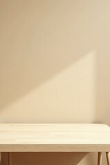 A Minimalist Empty Light Wooden Tabletop Against a Neutral Beige Wall Background with Soft Sunlight Shadow
