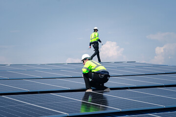 Engineer team installs solar cells check installation solar cell on the roof Sustainable energy...