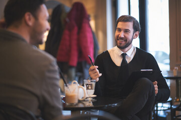 Young businesspeople working in restaurant