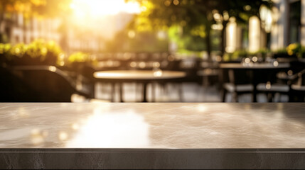 A smooth, empty stone surface bathed in warm golden light, with a blurred restaurant scene in the background. Tables, chairs, and soft bokeh effects add a gentle, refined backdrop