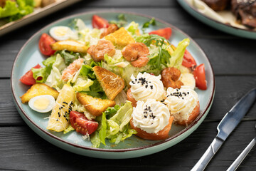 gourmet salad with shrimp and salmon rolls