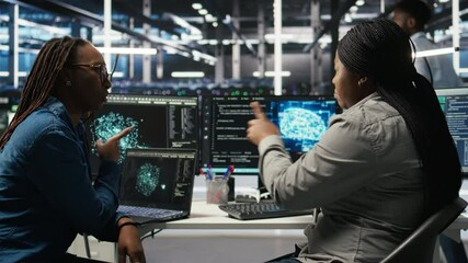 Data center engineering team deploying AI solutions optimizing gear. Server hub teamworking colleagues working together, using artificial intelligence to minimize systems downtime, camera A - Powered by Adobe