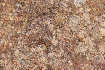 Close-Up of Natural Textured Surface of a Brownish Granite Rock