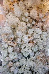 Close-up floral wedding background with lush compositions of white and pink flowers.