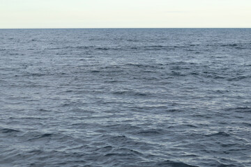 Obraz premium Adriatic sea. Nature background. Space. Sea with small waves, ripples on the water. Water surface with small waves. Background. Horizon