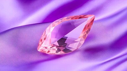 Pink gemstone on purple silk