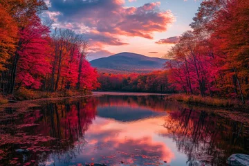 Vibrant autumn scenery reflects on calm water with colorful trees at sunset in a serene mountain landscape