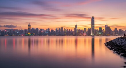 Fototapeta premium Serene Skyline Sunrise Reflection - Calm waters reflect a misty morning cityscape at sunrise, symbolizing tranquility, urban beauty, peaceful dawn, travel destination, and vibrant city life