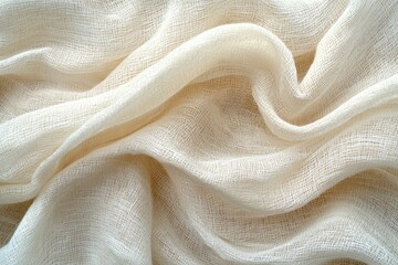 Soft white fabric draping elegantly in natural light highlighting its texture and movement