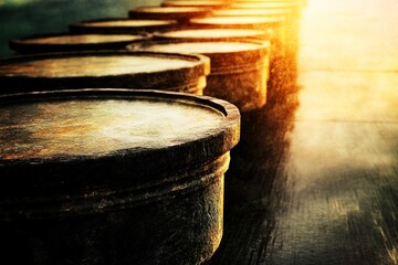Fototapeta premium Rows of dumbbells lined up in the gym catch the morning sunlight