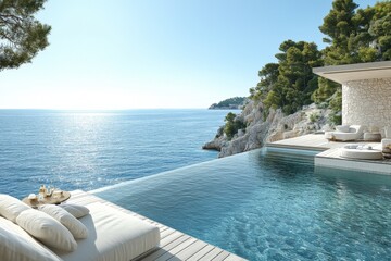 Obraz premium Luxurious infinity pool overlooking the serene ocean at a coastal retreat during a clear sunny day