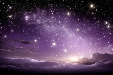 Majestic night sky illuminated by stars over soft clouds at dawn near a horizon glowing with hints of purple and gold