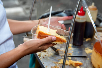 A woman displays homemade flan or Venezuelan cheese. Homemade food.